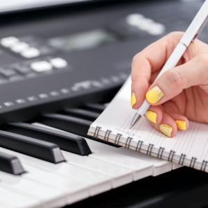 Woman writing music